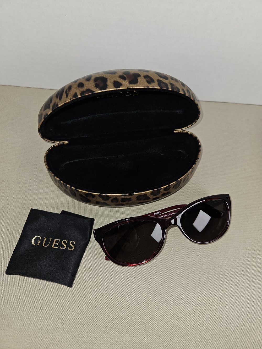 GUESS Women's Red Cat-Eye Sunglasses with Leopard Case